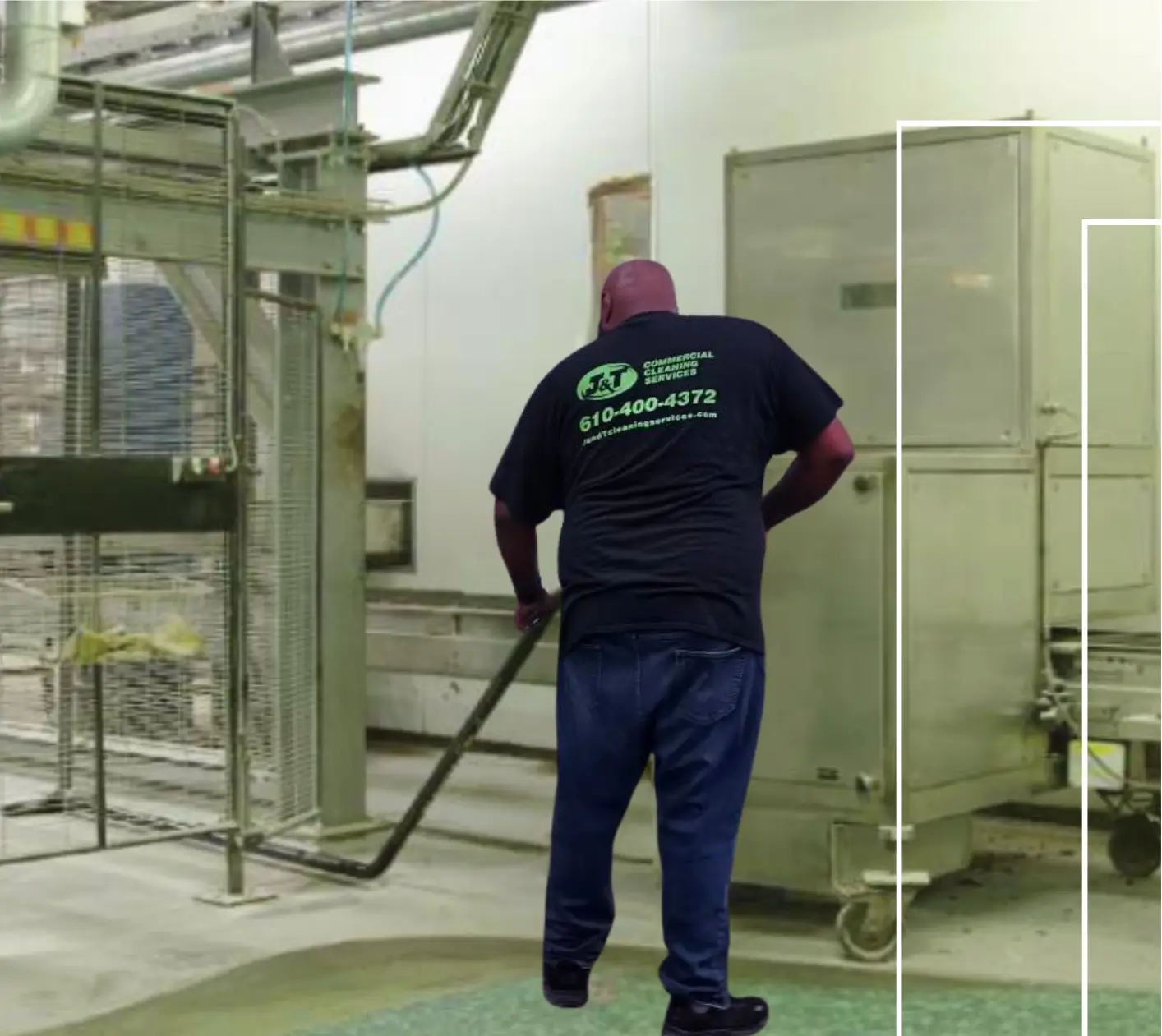 J&T employee dusting beneath warehouse equipment